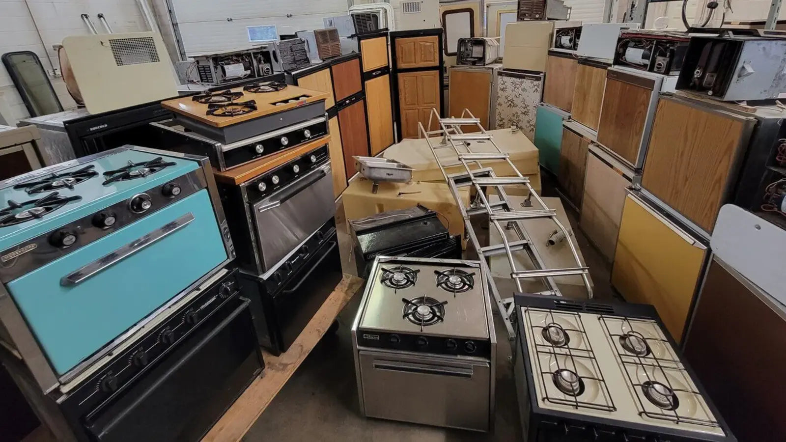 Used RV parts including propane appliances, fridges, ovens, furnaces, hot water heaters, and fresh water tanks, available for shipping across Canada and the U.S.